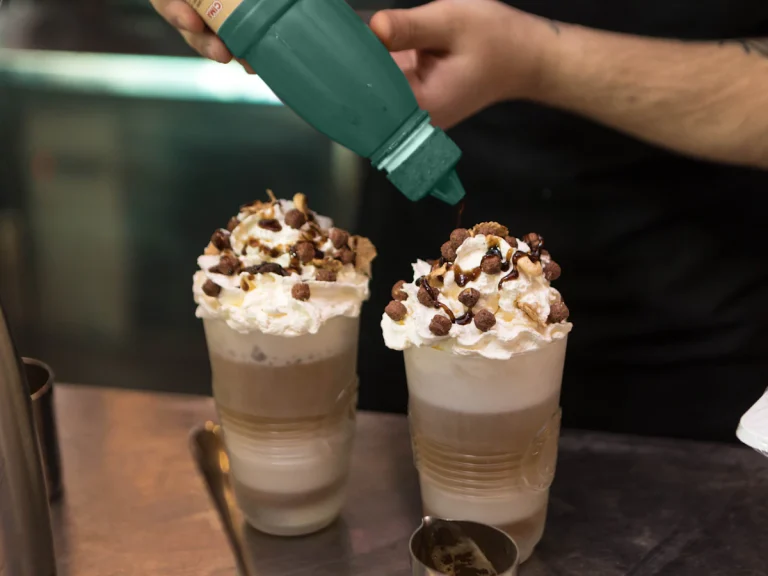 Blended iced coffee drinks topped with whipped cream