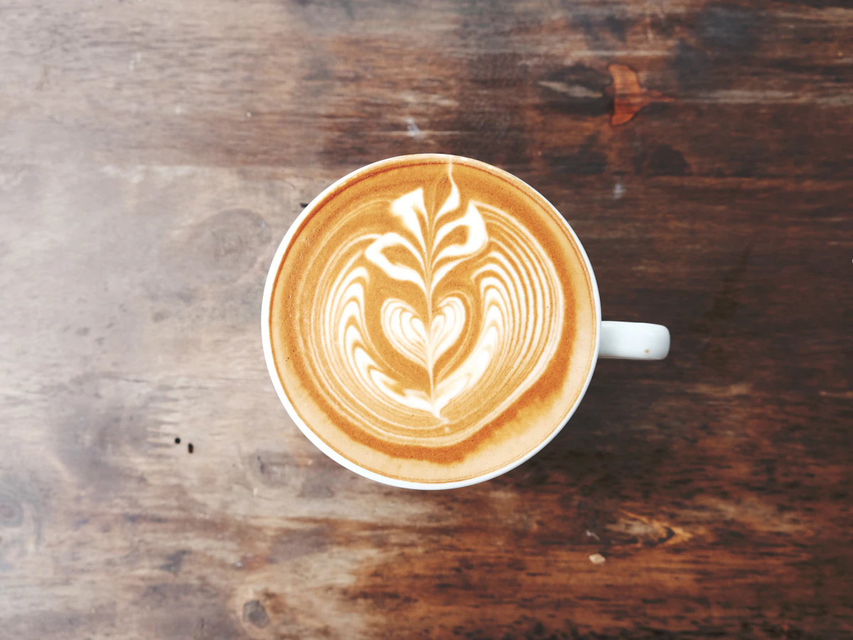 Hot latte with latte art, one of the most-ordered Starbucks drinks