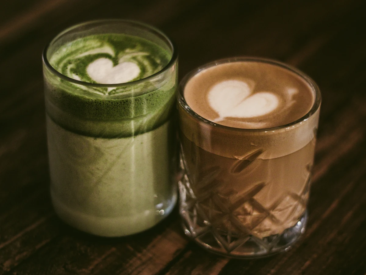 Matcha latte and latte in glass cups