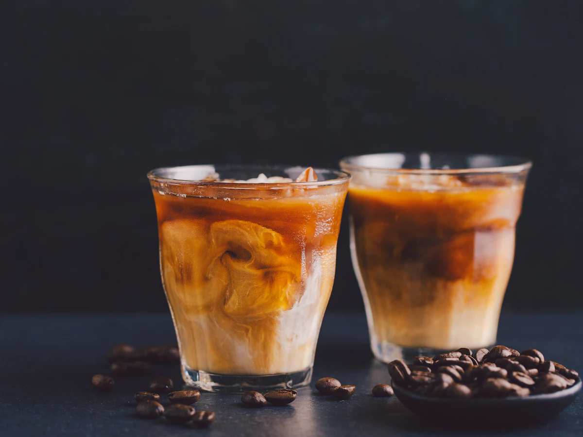 Two iced coffee drinks with milk